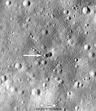 A rocket body hit the moon on March 4, creating a double crater, as indicated by the white arrow.
Mandatory Credit:	NASA/Goddard/Arizona State University