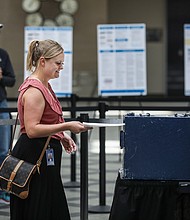 Harper Brown of Denver turns in her ballot as she votes on June 28. Republicans in Colorado rejected a 2020 election denier to be their next secretary of state.
Mandatory Credit:	Marc Piscotty/Getty Images