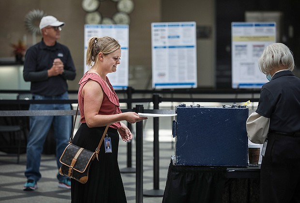 Harper Brown of Denver turns in her ballot as she votes on June 28. Republicans in Colorado rejected a 2020 election denier to be their next secretary of state.
Mandatory Credit:	Marc Piscotty/Getty Images