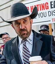 Otero County Commissioner Couy Griffin stands outside the federal court on March 22, in Washington. A federal judge rejected an attempt by a New Mexico county commissioner to shut down state proceedings against him that seek to remove him from office because of his conviction for trespassing on US Capitol grounds on January 6, 2021.
Mandatory Credit:	Gemunu Amarasinghe/AP/FILE