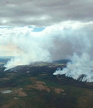 The East Fork Fire burns through the southern Alaskan Tundra near St. Mary's on June 9. Anchorage is experiencing its second-warmest June, according to climate scientist Brian Brettschneider. And with only 0.07 inches of rain this month in Anchorage, southern Alaska's parched wilderness has become fuel for wildfires.
Mandatory Credit:	BLM Alaska Fire Service/AP/FILE