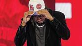 Jaden Ivey dons a Detroit Pistons cap after being selected fifth overall June 23 by the Pistons in the NBA basketball draft in New York.