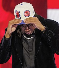 Jaden Ivey dons a Detroit Pistons cap after being selected fifth overall June 23 by the Pistons in the NBA basketball draft in New York.