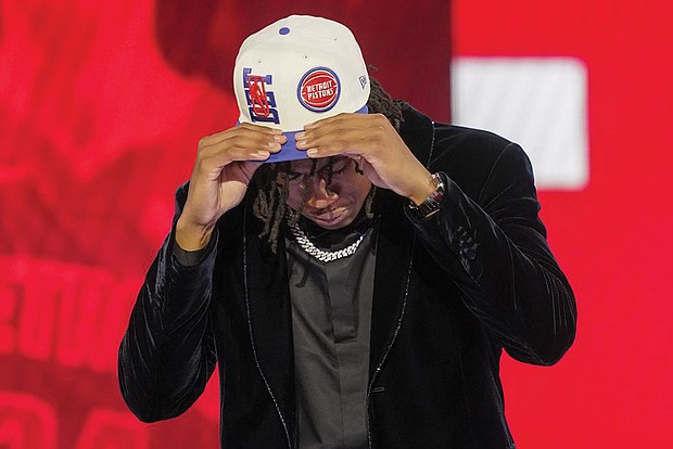 Jaden Ivey dons a Detroit Pistons cap after being selected fifth overall June 23 by the Pistons in the NBA basketball draft in New York.