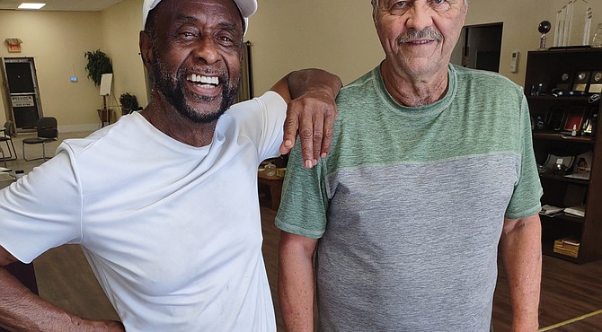 William “Junie” Bullock, left, was a Richmond firefighter for 18 years, during which time he heroically rescued several residents from the ninth floor of the Boxwood Building at Imperial Plaza on Bellevue Avenue. The 79-year-old Richmond native has never been recognized for his heroics on June 11, 1978. He shares memories of that day with retired firefighter Jack R. McIntyre, 72, who was driving the Company 46 ladder truck that enabled Mr. Bullock to gain entry to the top floor of the building.