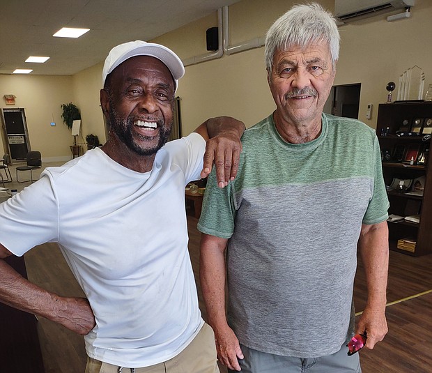 William “Junie” Bullock, left, was a Richmond firefighter for 18 years, during which time he heroically rescued several residents from the ninth floor of the Boxwood Building at Imperial Plaza on Bellevue Avenue. The 79-year-old Richmond native has never been recognized for his heroics on June 11, 1978. He shares memories of that day with retired firefighter Jack R. McIntyre, 72, who was driving the Company 46 ladder truck that enabled Mr. Bullock to gain entry to the top floor of the building.