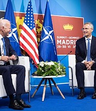 NATO military officials said Secretary-General Jens Stoltenberg's, right, announcement earlier this week that 300,000 troops would be placed on high alert across the alliance is something the alliance will work on going forward, rather than an immediate shift.
Mandatory Credit:	CNN