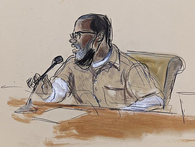 In this courtroom sketch, R. Kelly briefly addresses Judge Ann Donnelly during his sentencing June 29 in federal court in New York. R. Kelly was sentenced to 30 years in prison for using his superstardom to subject young fans — some just children — to systematic sexual abuse.