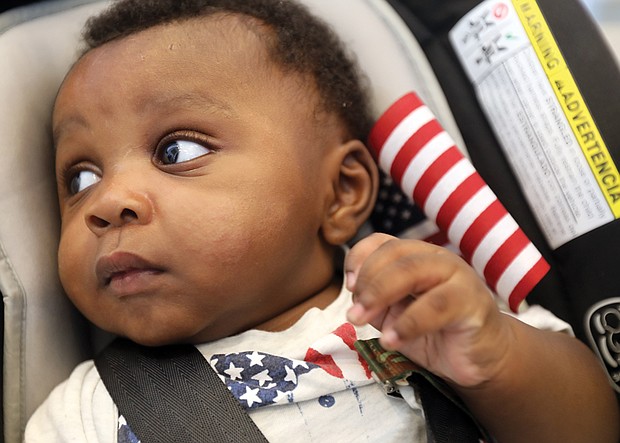 At just 4 months, Zachariah Fakondor eagerly accompanied his father, Philip Fakondor, to a citizenship ceremony at the Virginia Museum of History & Culture on Monday. Mee-Kema Fakondor, Zachariah’s mom and Mr. Fakondor’s wife, was among 46 people from 29 countries who were sworn in as American citizens.