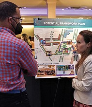 Maritza M. Pechin, deputy director for Richmond’s Office of Equitable Development, and C.B. Chambliss discuss the latest framework for the Reconnect Jackson Ward Project last Wednesday at the Hippodrome Theater.