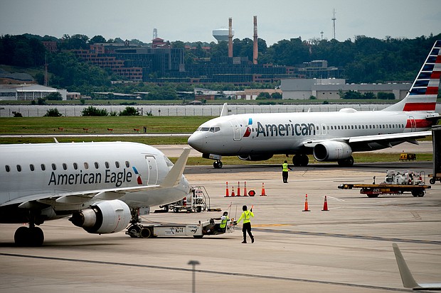 American Airlines has agreed to pay its pilots triple their normal rate after a computer scheduling glitch left thousands of flights with understaffed cockpits.
Mandatory Credit:	Stefani Reynolds/AFP/Getty Images