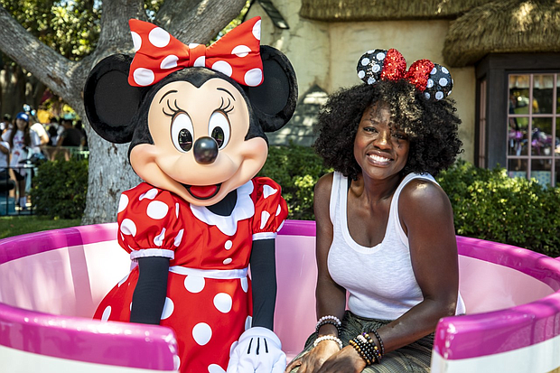 Award-winning actress Viola Davis shares a special moment with Minnie Mouse while vacationing at Disneyland Park in Anaheim, Calif., July 11, 2022. (Christian Thompson/Disneyland Resort)