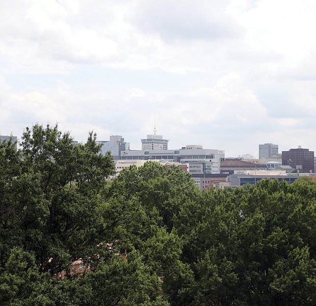 On a clear or even cloudy day, Richmond’s skyline is visible from all sorts of tall buildings and higher-than-average hilltops. On July 8, we captured the city’s natural and concrete glow as it appears from the former Frederic A. Fay Towers’ eighth floor. The vacant building is at 1202 N 1st St.