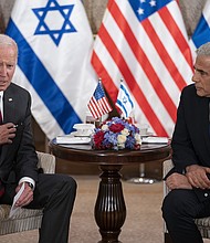 President Joe Biden, pictured with Israeli Prime Minister Yair Lapid in Jerusalem on July 14, stopped short of committing to raise the 2018 murder of journalist Jamal Khashoggi with leaders in Saudi Arabi.
Mandatory Credit:	Evan Vucci/AP