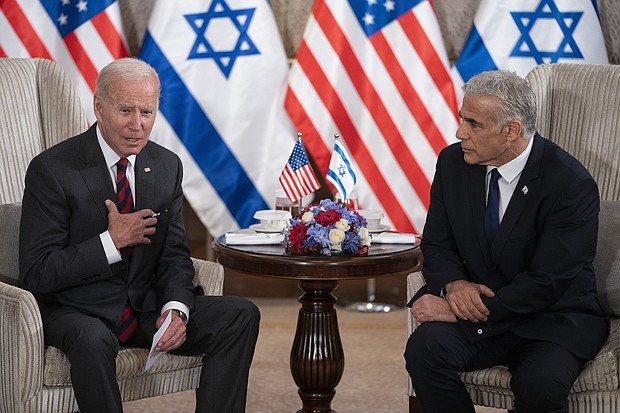 President Joe Biden, pictured with Israeli Prime Minister Yair Lapid in Jerusalem on July 14, stopped short of committing to raise the 2018 murder of journalist Jamal Khashoggi with leaders in Saudi Arabi.
Mandatory Credit:	Evan Vucci/AP