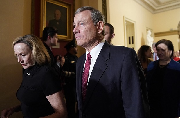 U.S. Supreme Court Chief Justice John Roberts departs with his wife Jane after U.S. President Donald Trump concluded his second State of the Union address to a joint session of the U.S. Congress in the House Chamber of the U.S. Capitol in Washington, U.S. February 5, 2019.
Mandatory Credit:	Joshua Roberts/Reuters