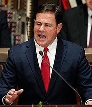 Arizona Republican Gov. Doug Ducey, pictured on January. 10, in Phoenix  warned voters in his state against Kari Lake, the far-right, gubernatorial candidate endorsed by former President Donald Trump.
Mandatory Credit:	Ross D. Franklin/AP