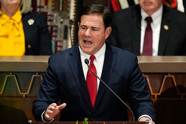 Arizona Republican Gov. Doug Ducey, pictured on January. 10, in Phoenix  warned voters in his state against Kari Lake, the far-right, gubernatorial candidate endorsed by former President Donald Trump.
Mandatory Credit:	Ross D. Franklin/AP