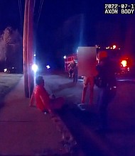 Seen on body camera footage, Nicholas Bostic is treated by first responders after rescuing several children from a burning home in Lafayette, Indiana, on July 11.
Mandatory Credit:	Lafayette Police