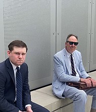 Former Trump White House aide Garrett Ziegler, left, waits Tuesday near a room on Capitol Hill where the January 6 committee conducts its closed-door witness interviews.
Mandatory Credit:	Andrew Millman/CNN