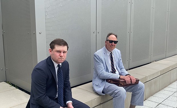 Former Trump White House aide Garrett Ziegler, left, waits Tuesday near a room on Capitol Hill where the January 6 committee conducts its closed-door witness interviews.
Mandatory Credit:	Andrew Millman/CNN