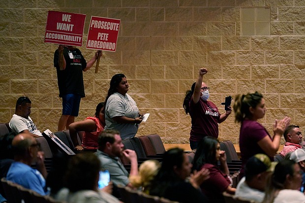 Parents and family attend a special meeting of the Board of Trustees of Uvalde Consolidated Independent School District where parents addressed last months' shootings at Robb Elementary School, Monday, July 18, 2022, in Uvalde, Texas.
Mandatory Credit:	Eric Gay/AP