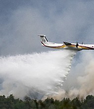 Millions of people across Europe were sweltering in yet more extreme heat on July 20, as raging wildfires tore through the countryside, forcing thousands from their homes and blanketing parts of Italy, Greece and France in smoke.
Mandatory Credit:	Loic Venance/AFP/Getty Images