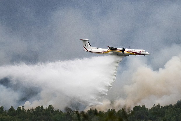 Millions of people across Europe were sweltering in yet more extreme heat on July 20, as raging wildfires tore through the countryside, forcing thousands from their homes and blanketing parts of Italy, Greece and France in smoke.
Mandatory Credit:	Loic Venance/AFP/Getty Images