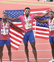 Fred Kerley, center, Marvin Bracy-Williams, right, and Trayvon Bromell, finish first, second and third place respectively July 16 in the U.S. World Athletic Championships, in Eugene, Ore.