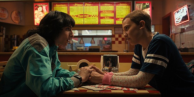 (L to R) Finn Wolfhard as Mike Wheeler and Millie Bobby Brown as Eleven in Netflix's Stranger Things. Netflix lost roughly a million customers last quarter — the most in the company's 25-year history.
Mandatory Credit:	Courtesy of Netflix