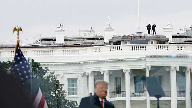 Members of the Secret Service patrol from the roof of the White House on January 6, 2021. The Department of Homeland Security inspector general has directed the Secret Service to stop investigating potentially missing texts related to January 6.
Mandatory Credit:	MANDEL NGAN/AFP via Getty Images
