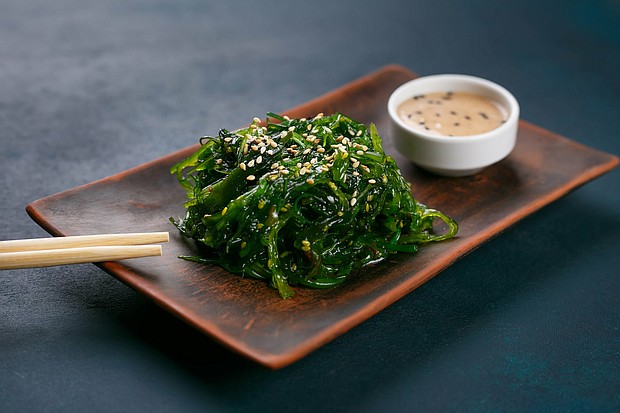Delicious Japanese cuisine, wakame chuka salad with spicy sauce served on authentic square clay plate, close up.
Mandatory Credit:	Adobe Stock