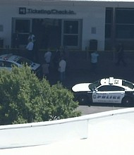 A woman allegedly fired gunshots at Dallas Love Field Airport on Monday before she was shot by an officer, police said. No one else was injured.
Mandatory Credit:	KTVT