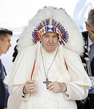 Pope Francis wears a traditional headdress that was gifted to him by indigenous leaders following his apology during his visit on July 25 in Maskwacis, Canada. The Pope is touring Canada, meeting with Indigenous communities and community leaders in an effort to reconcile the harmful legacy of the church's role in Canada's residential schools.
Mandatory Credit:	Cole Burston/Getty Images
