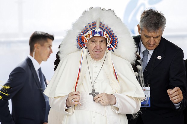 Pope Francis wears a traditional headdress that was gifted to him by indigenous leaders following his apology during his visit on July 25 in Maskwacis, Canada. The Pope is touring Canada, meeting with Indigenous communities and community leaders in an effort to reconcile the harmful legacy of the church's role in Canada's residential schools.
Mandatory Credit:	Cole Burston/Getty Images