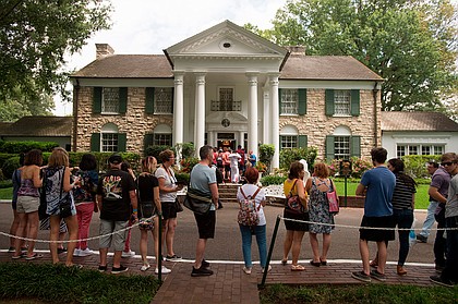 Fans wait in line outside Graceland, Elvis Presley's Memphis home, in Memphis, Tennessee, August 15, 2017.
Mandatory Credit:	Brandon Dill/Associated Press