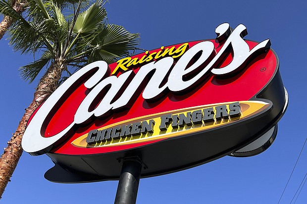 The founder of fast-food restaurant chain Raising Cane's bought 50,000 lottery tickets for employees.
Mandatory Credit:	Kirby Lee/AP