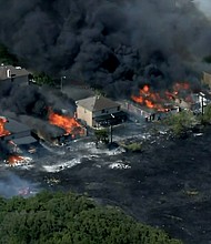Flames spread to at least 14 homes in Balch Springs, about 15 miles southeast of Dallas.
Mandatory Credit:	KTVT