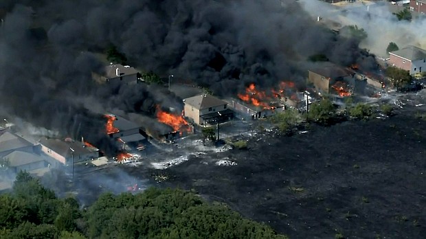 Flames spread to at least 14 homes in Balch Springs, about 15 miles southeast of Dallas.
Mandatory Credit:	KTVT