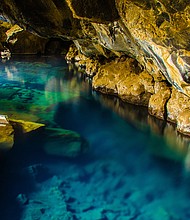 Myvatn has a hot pool in a cave.
Mandatory Credit:	Simon Dannhauer/Adobe Stock