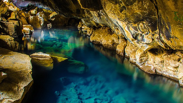 Myvatn has a hot pool in a cave.
Mandatory Credit:	Simon Dannhauer/Adobe Stock