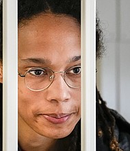 WNBA star and two-time Olympic gold medalist Brittney Griner speaks to her lawyers standing in a cage at a court room prior to a hearing just outside Moscow.
Mandatory Credit:	Alexander Zemlianichenko/AP