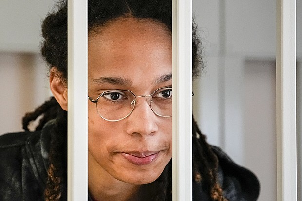 WNBA star and two-time Olympic gold medalist Brittney Griner speaks to her lawyers standing in a cage at a court room prior to a hearing just outside Moscow.
Mandatory Credit:	Alexander Zemlianichenko/AP
