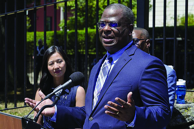 Michael Cox, right, who has been named as the next Boston Police commissioner, talks with reporters as Boston Mayor Michelle Wu, left, looks on during a news conference, Wednesday, July 13, in Boston’s Roxbury neighborhood. Mr. Cox, who was beaten more than 25 years ago by colleagues who mistook him for a suspect in a fatal shooting, served in multiple roles with the Boston Police Department before becoming the police chief in Ann Arbor, Michigan, in 2019.