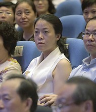 Yang Huiyan (C), Asia's wealthiest woman, is seen here in Foshan city, China's Guangdong province, in June 2016. Huiyan has seen her wealth fall to $11 billion from nearly $24 billion this year as China's property crisis escalates.
Mandatory Credit:	Fang Xing/ICHPL Imaginechina/AP