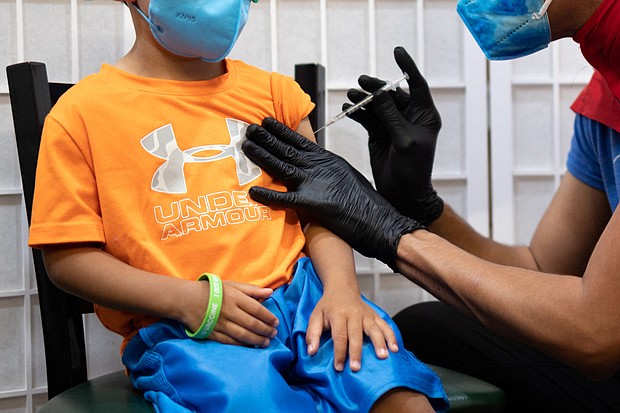 A 4-year-old receives a coronavirus disease (COVID-19) vaccine for children under five years old at Skippack Pharmacy in Schwenksville, Pennsylvania, U.S., June 21, 2022.
Mandatory Credit: Hannah Beier/Reuters/FILE