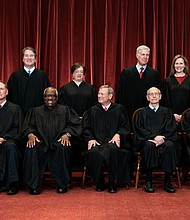 Members of the Supreme Court pose for a group photo at the Supreme Court in Washington, DC on April 23, 2021. Seated from left: Associate Justice Samuel Alito, Associate Justice Clarence Thomas, Chief Justice John Roberts, Associate Justice Stephen Breyer and Associate Justice Sonia Sotomayor, Standing from left: Associate Justice Brett Kavanaugh, Associate Justice Elena Kagan, Associate Justice Neil Gorsuch and Associate Justice Amy Coney Barrett.
