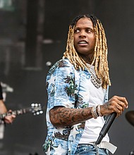 Lil Durk performs on day three of the Lollapalooza Music Festival on Saturday, July 30 at Grant Park in Chicago. The rapper is taking a break after a Lollapalooza pyrotechnics explosion.
Mandatory Credit:	Amy Harris/Invision/AP