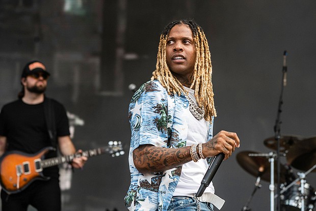 Lil Durk performs on day three of the Lollapalooza Music Festival on Saturday, July 30 at Grant Park in Chicago. The rapper is taking a break after a Lollapalooza pyrotechnics explosion.
Mandatory Credit:	Amy Harris/Invision/AP
