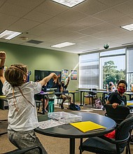 Most US public schools plan to keep masks optional for the start of classes. Children participate in a class activity at the Xavier Academy on August 23, 2021 in Houston, Texas.
Mandatory Credit:	Brandon Bell/Getty Images